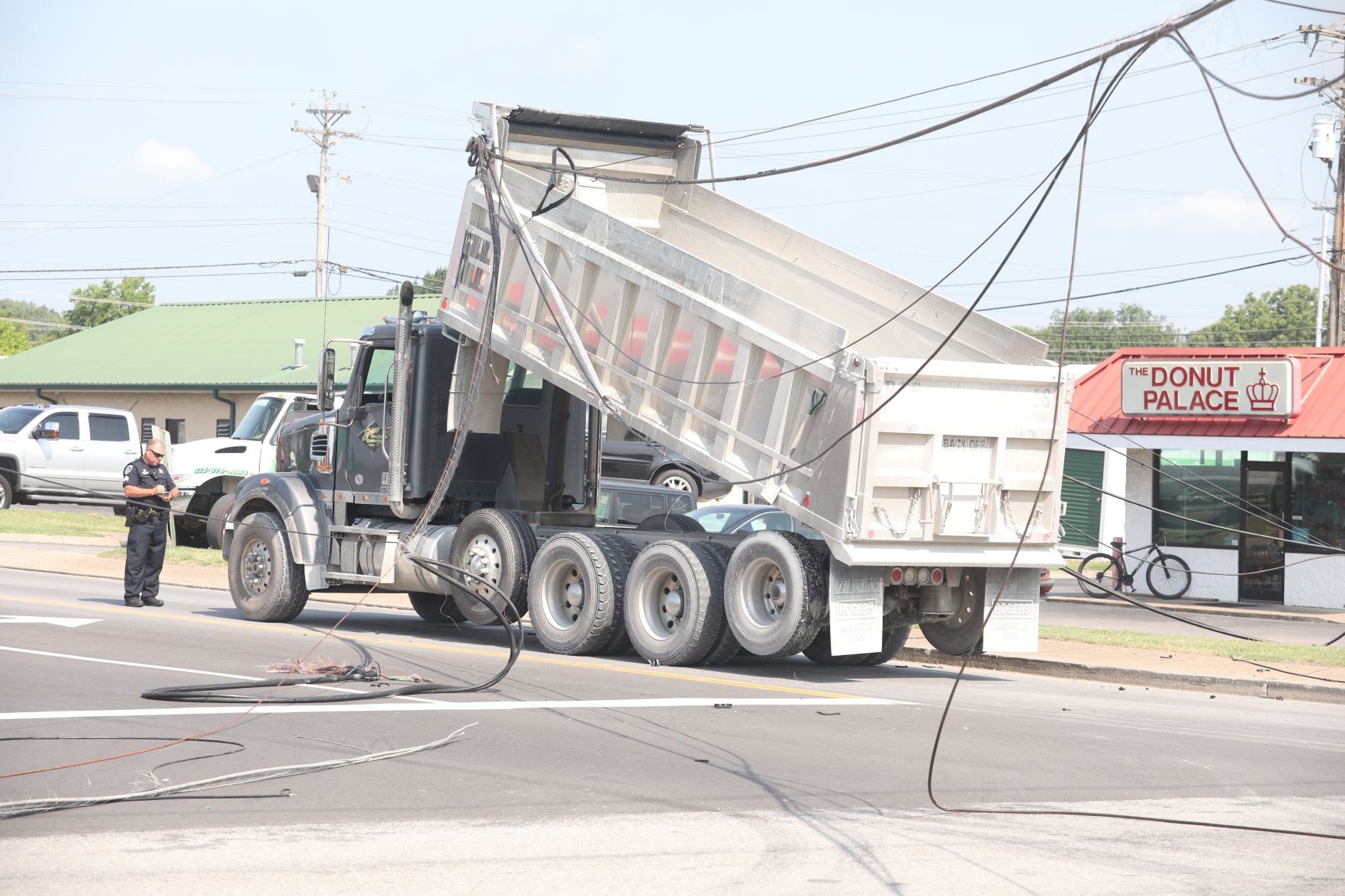 Truck snags phone lines